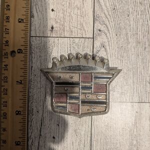 Cadillac Silver and Red Car Emblem